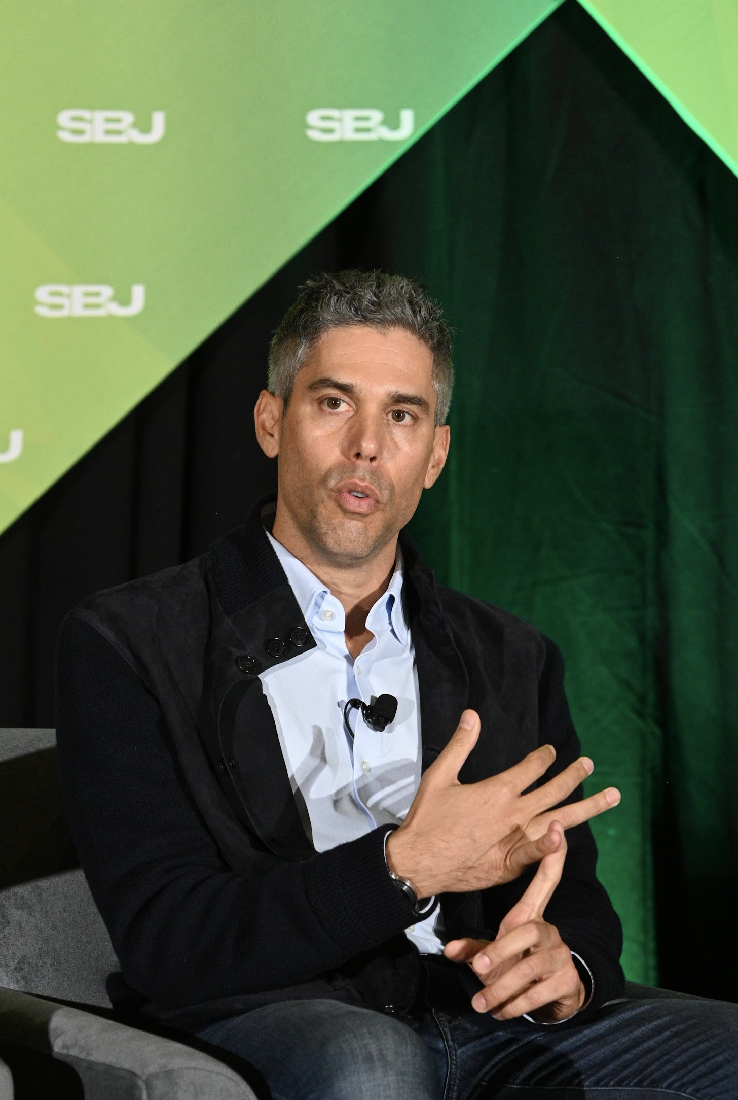 Ryan Spoon speaking at an SBJ event